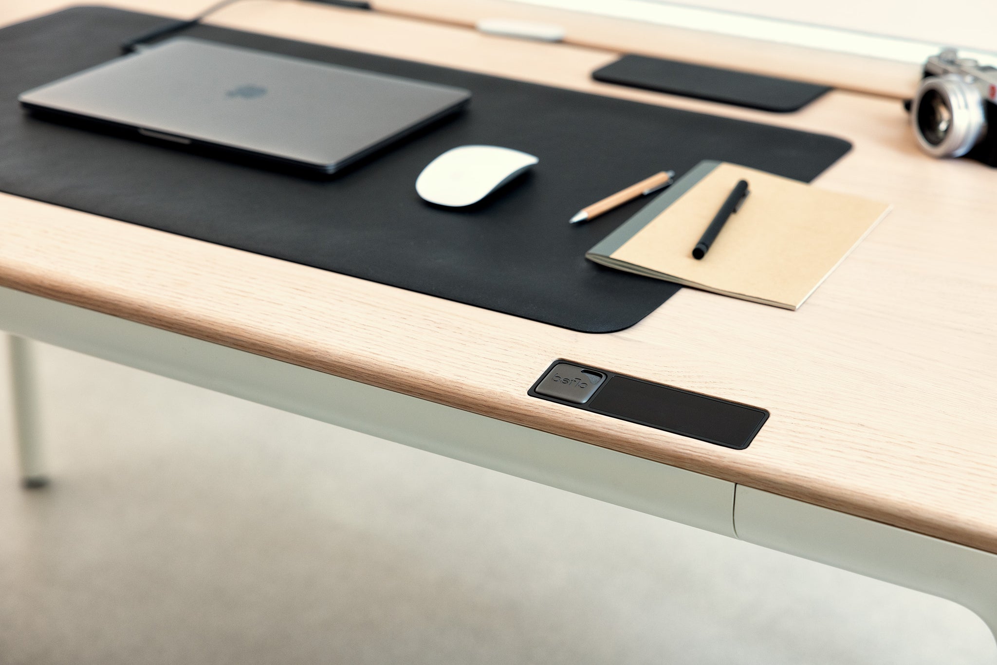 Close up view ofTenon desk with moss deskmat