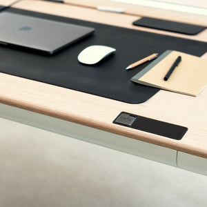 Close up view ofTenon desk with moss deskmat